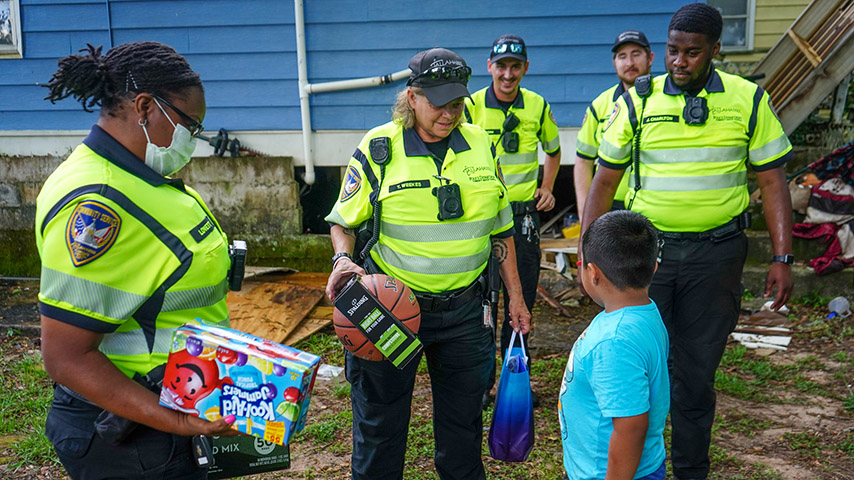 Officers handing out gifts during the holiday season